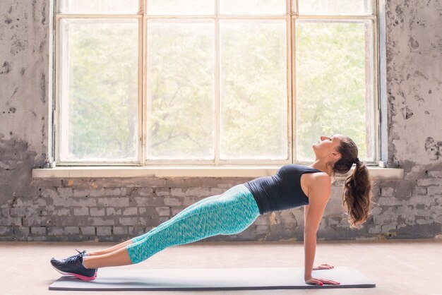 Reverse Plank with Arm Lift